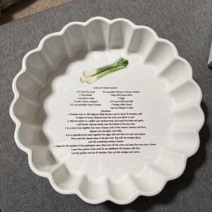 This is a vintage white ceramic quiche or flan baking dish